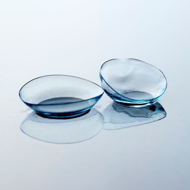 Contact lenses arranged neatly on a surface.