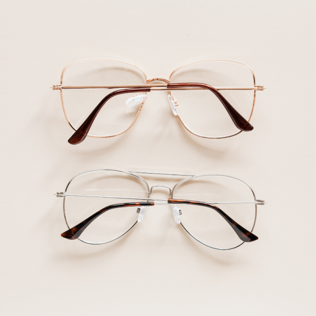 Two pairs of elegant glasses with optical lenses.