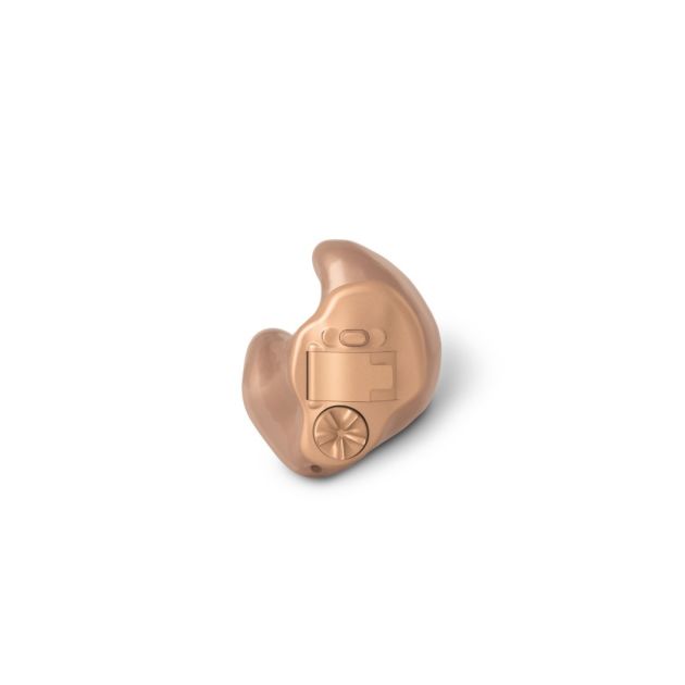 A woman's ear with In-The-Ear Hearing Aids.