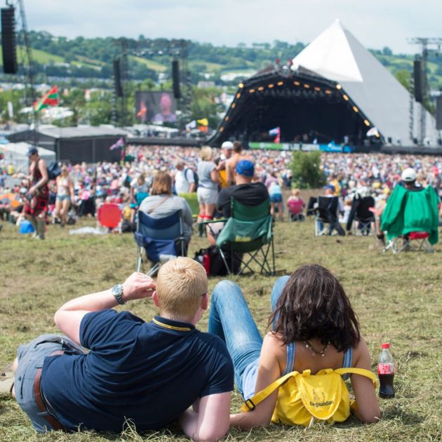 couple sat down at music festival