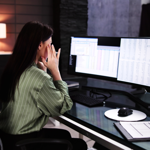 Woman tired at work at her desk.