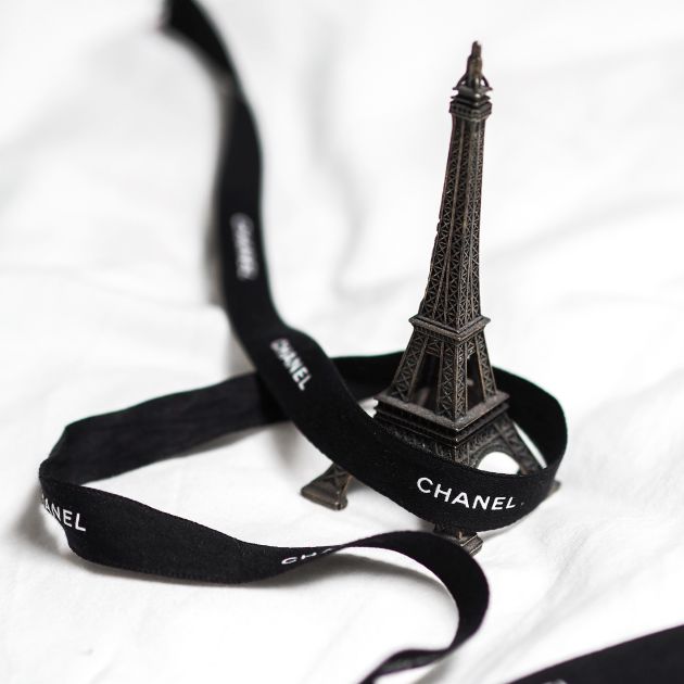 A scale model of the tower with a Chanel ribbon.