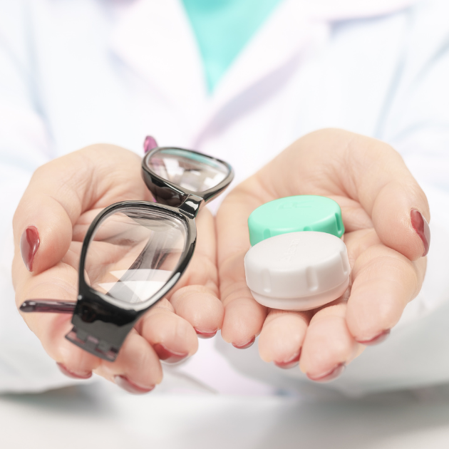 An eye doctor offering the choice between eyewear or contact lenses to a patient.