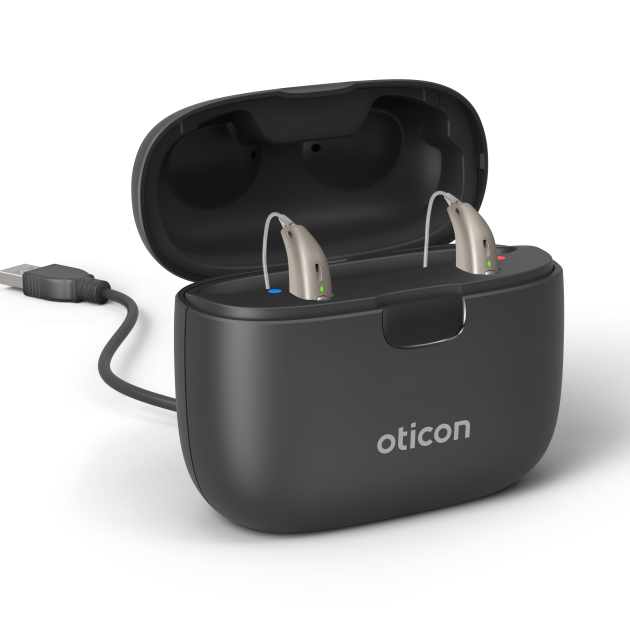 Oticon Real hearing aids in the charger.