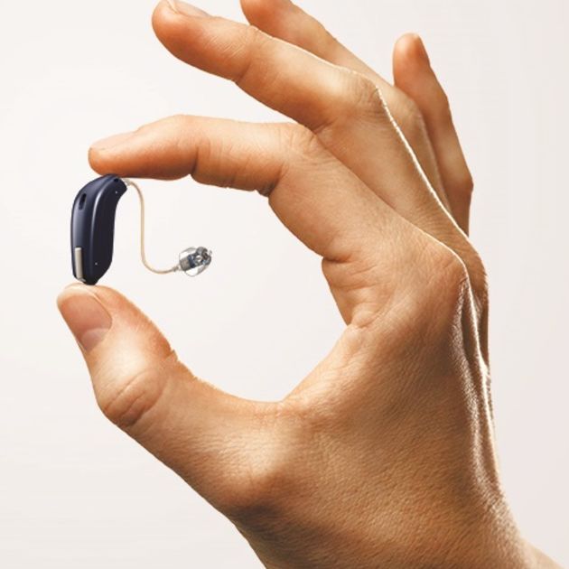 opn hearing aid in hand