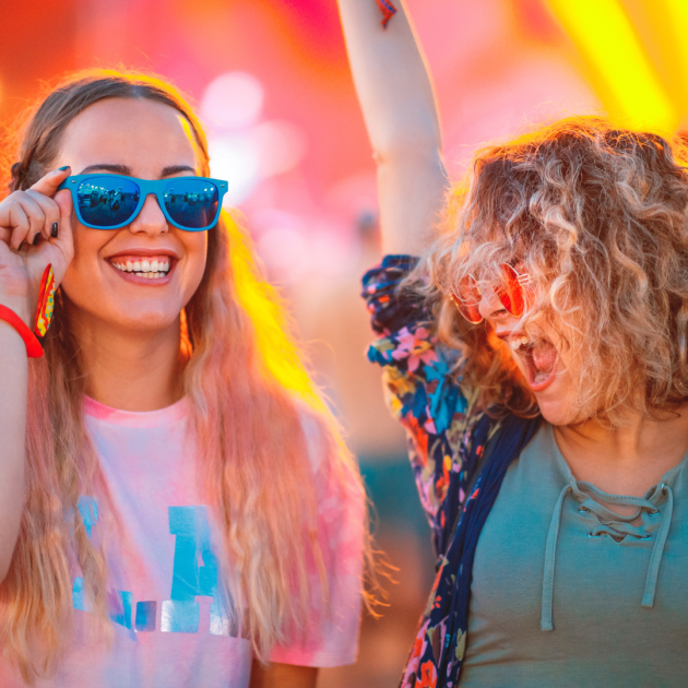Two young women enjoying a music festival