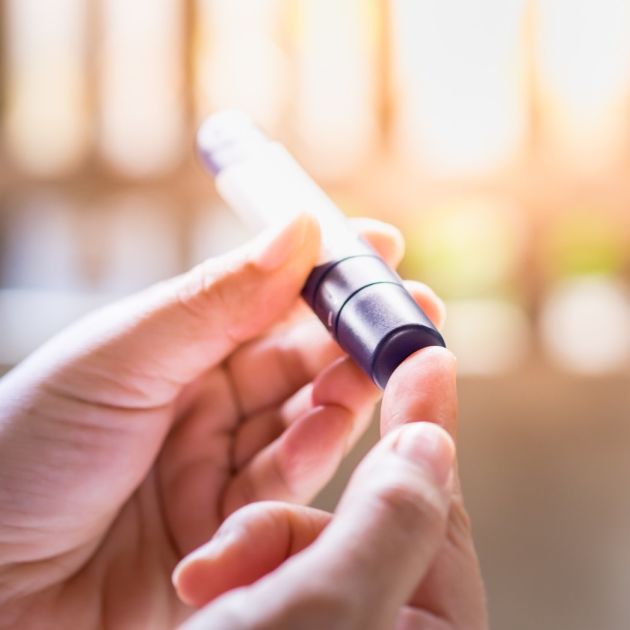 A diabetes patient checking their blood sugar