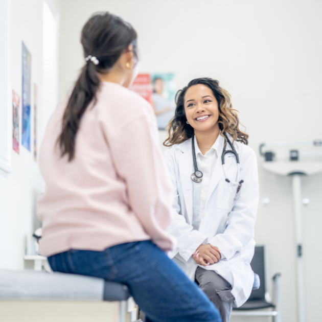 A woman and a doctor during a medical appointment.