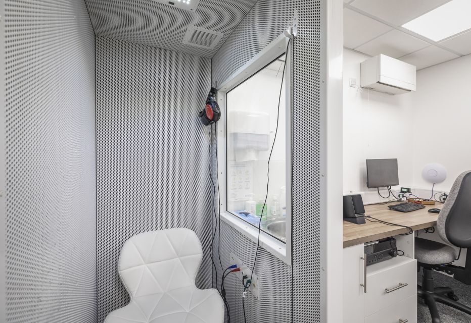 Interior of a fully equipped hearing assessment room.