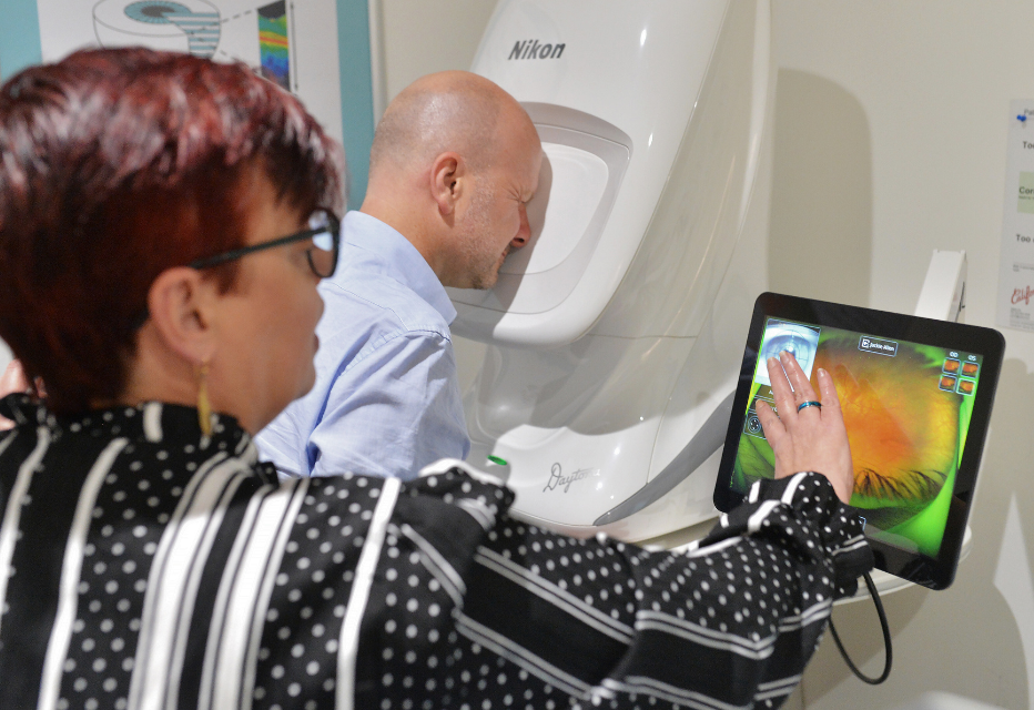 A patient having optomap during an eye test.