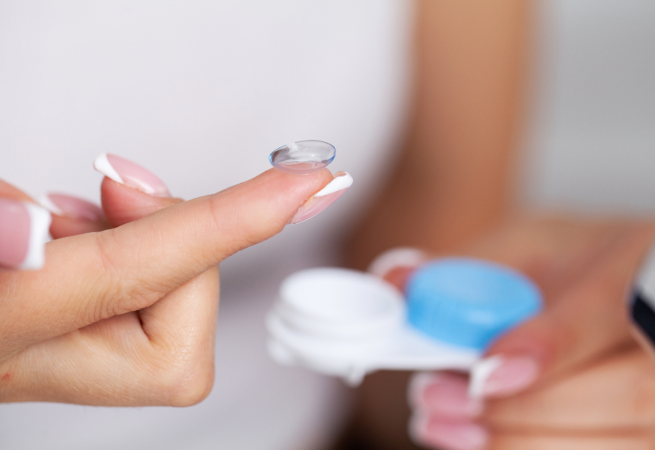 Close up of Woman Holding Contact Lens on Finger.