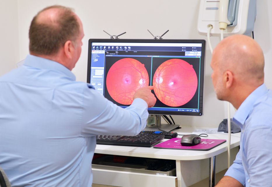 A patient having a digital retina scanner during an eye test.