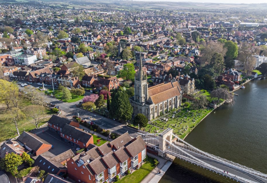 A view of Marlow city featuring its iconic suspension bridge.