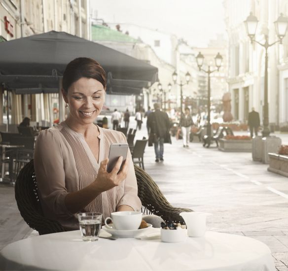 woman outside with smartphone