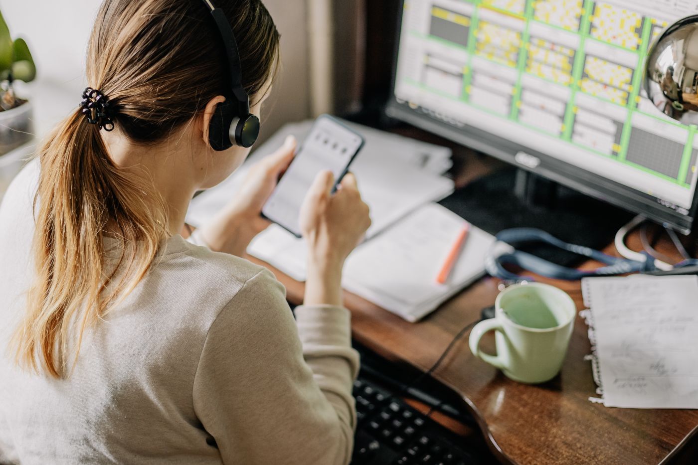 Woman working from home with headphones on