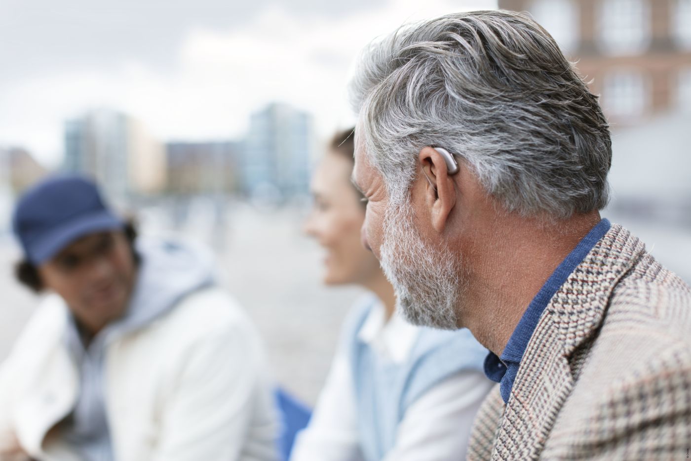 Man wearing Oticon hearing aid