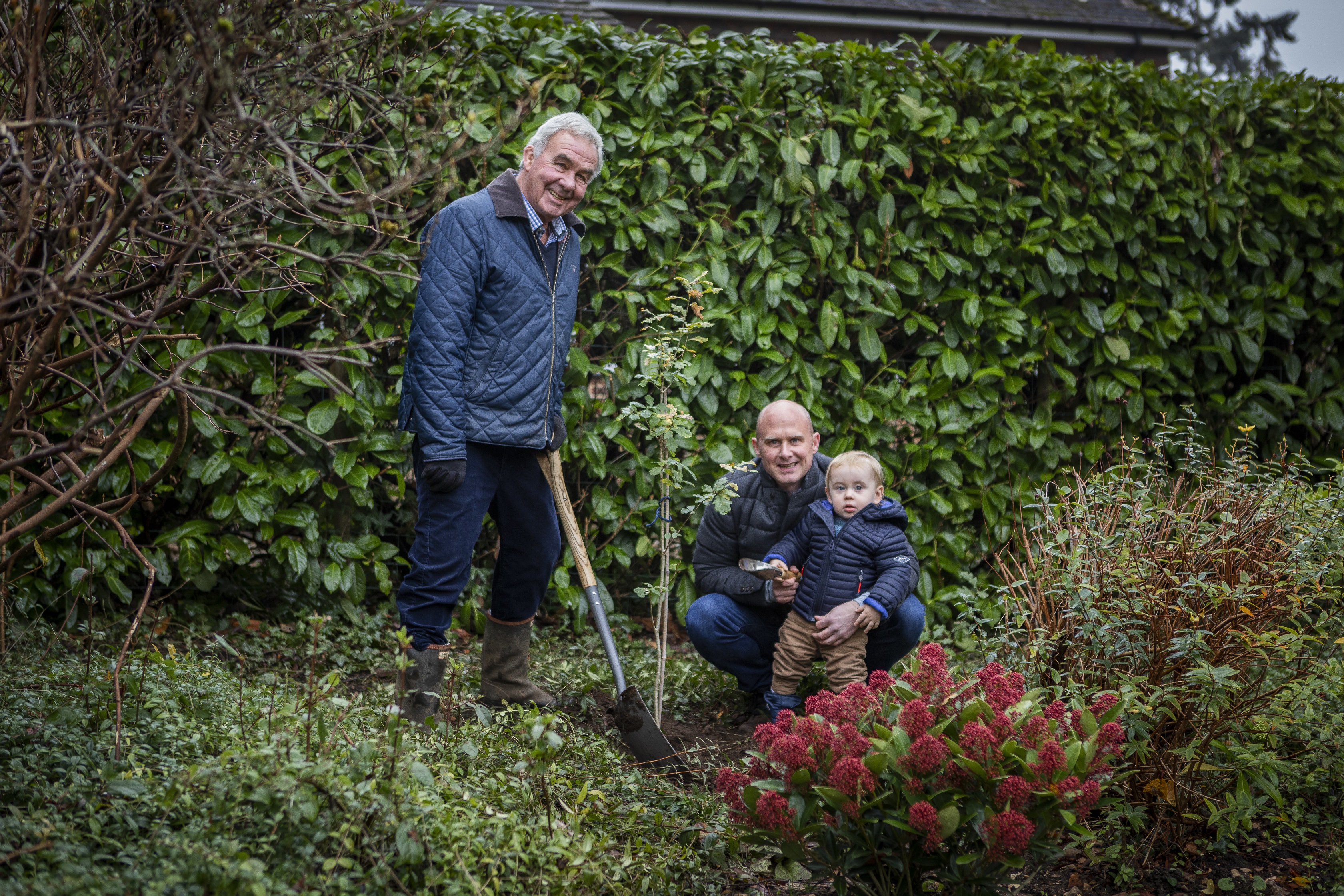 Richard, Ryan and Zachary Leighton in their garden.