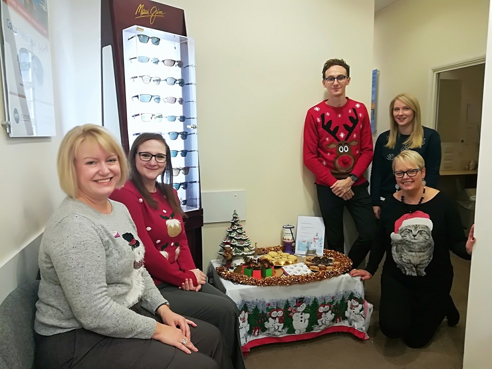 Leightons team around the decorated table.