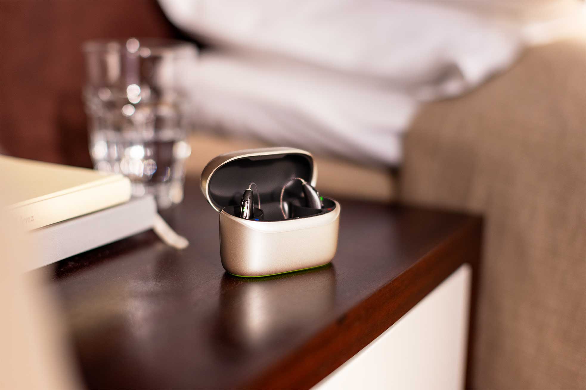 Phonak Audéo Sphere Infinio hearing aids placed in their charging case.