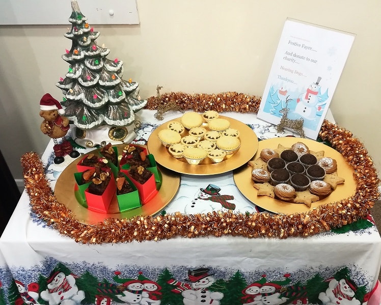 Christmas biscuits on a decorated table.