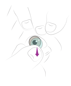 A diagram illustrating how to slide the lens down before pinching it for safe removal.