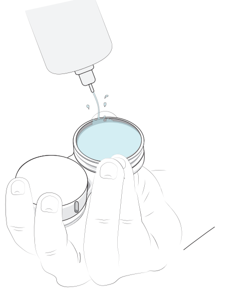 A diagram illustrating how to fill a contact lens case with solution.