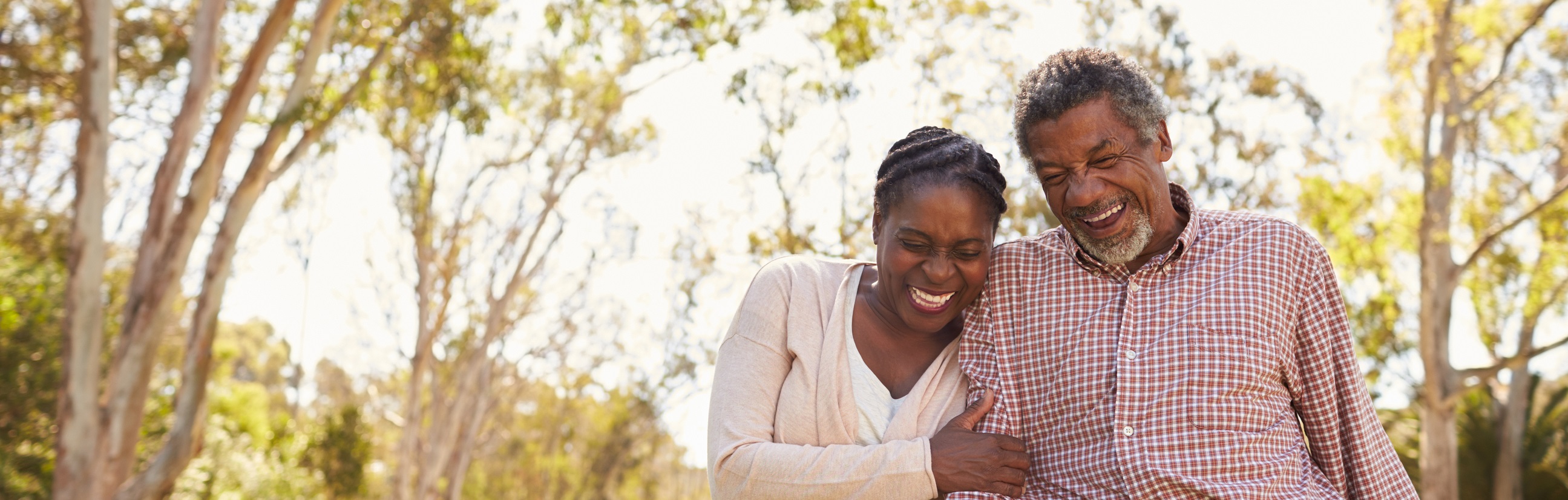 man and woman laughing outside