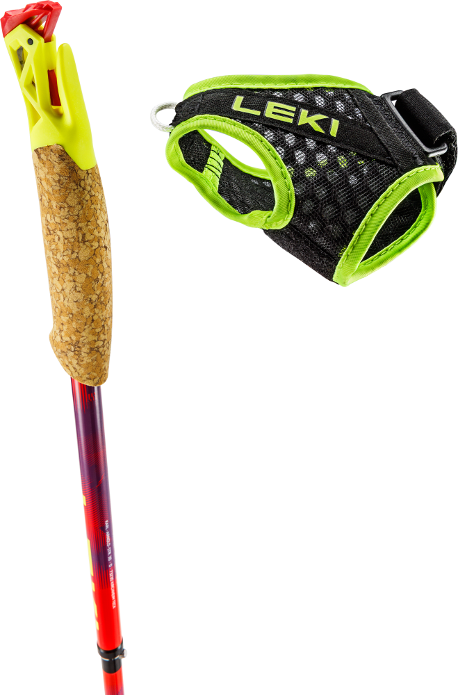 Cork trekking pole handle with yellow-green plastic top; beside it a black mesh strap with neon-green trim and Velcro adjustment.