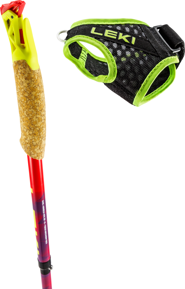 Cork grip of a red trekking pole with a yellow top piece; beside it a detachable black mesh hand strap with lime-green trim.