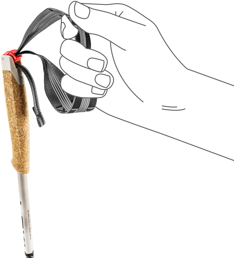 Hand holds an adjustable wrist strap on a trekking pole with cork grip and red strap adjuster.