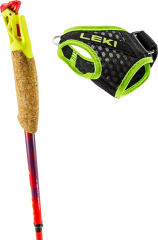 Cork trekking pole handle with yellow-green plastic top; beside it a black mesh strap with neon-green trim and Velcro adjustment.