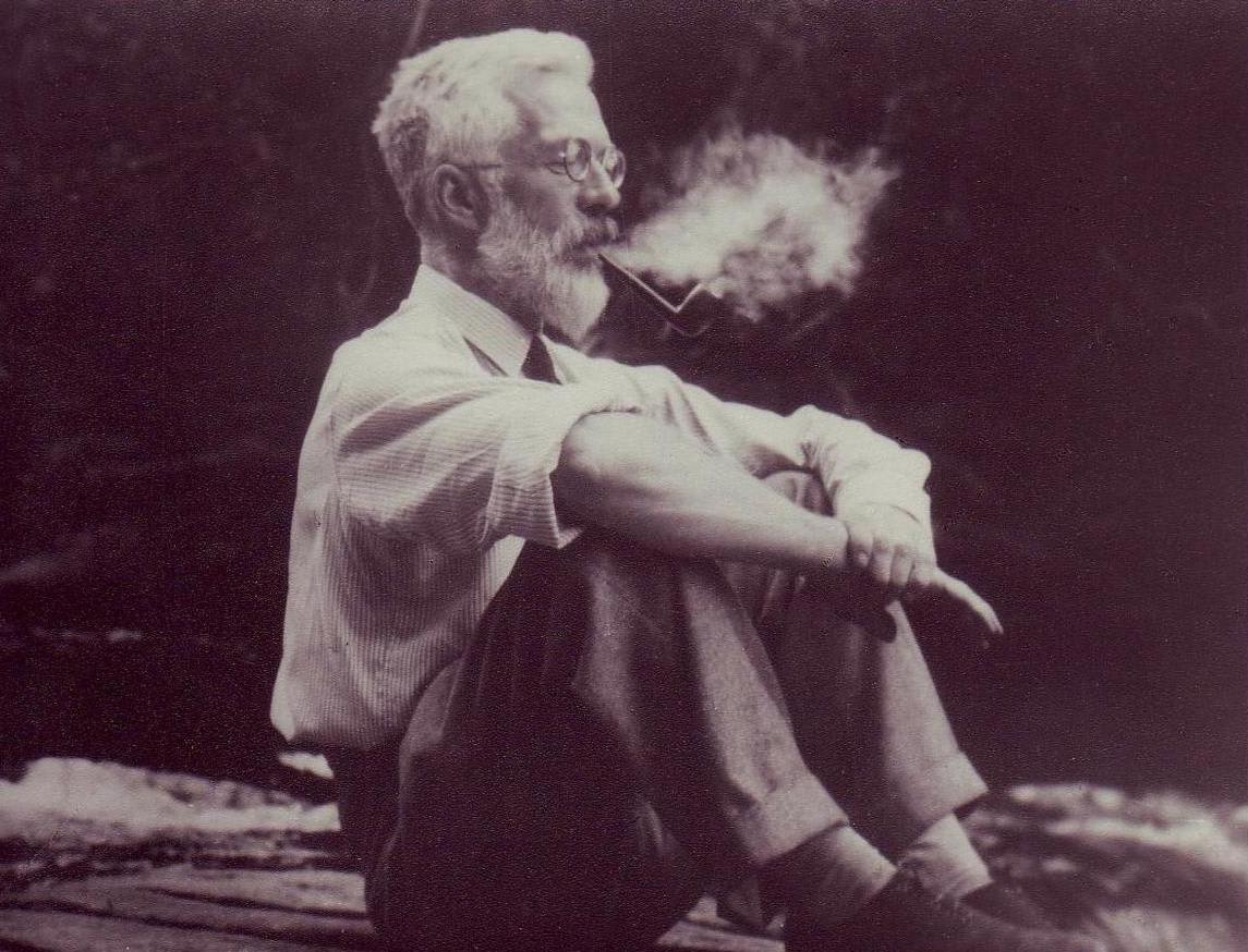 Picture of Ronald Fisher sitting and smoking