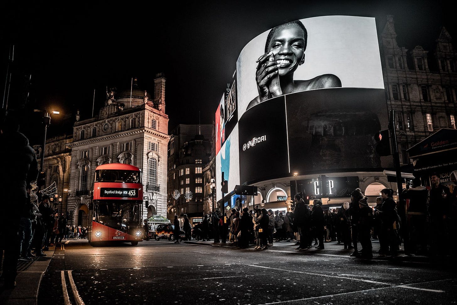 Outdoor ads over darkened figures
