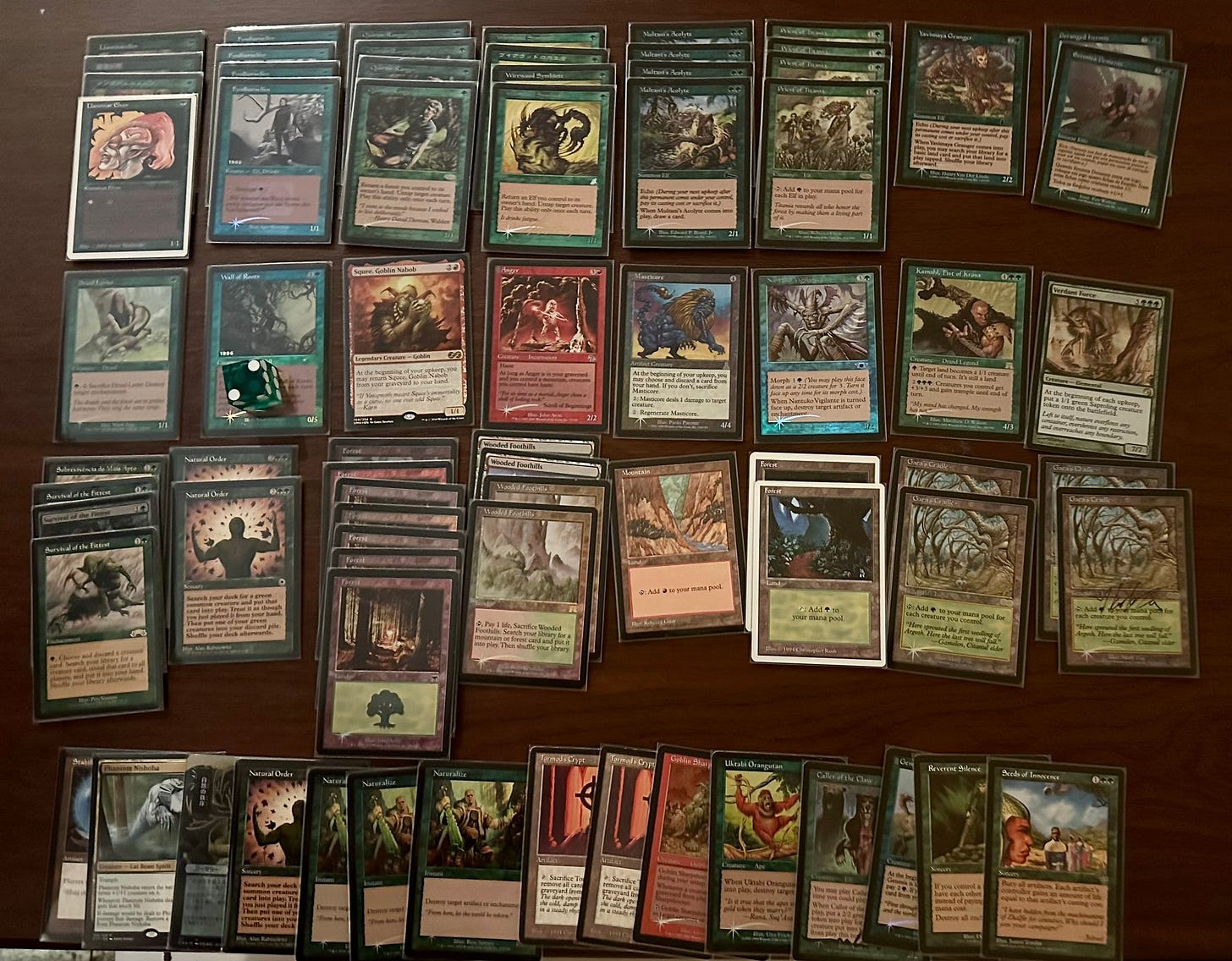 Decklist:

Main Deck
4 Llanowar Elves
4 Fyndhorn Elves
4 Quirion Ranger
4 Wirewood Symbiote
4 Multani’s Acolyte
4 Priest of Titania
1 Yavimaya Granger
2 Deranged Hermit
1 Druid Lyrist
2 Wall of Roots
1 Squee, Goblin Nabob
1 Anger
1 Masticore
1 Nantuko Vigilante
1 Kamahl, Fist of Krosa
4 Survival of the Fittest
2 Natural Order
1 Verdant Force
4 Wooded Foothills
4 Gaea’s Cradle
1 Mountain
9 Forest

Sideboard
3 Naturalize
1 Reverent Silence
1 Seeds of Innocense
2 Tormod’s Crypt
1 Stabilizer
2 Natural Order
1 Phantom Nishoba
1 Uktabi Orangutan
1 Goblin Sharpshooter
1 Caller of the Claw
1 Genesis