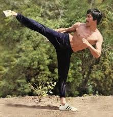 Bruce Lee performing a side kick