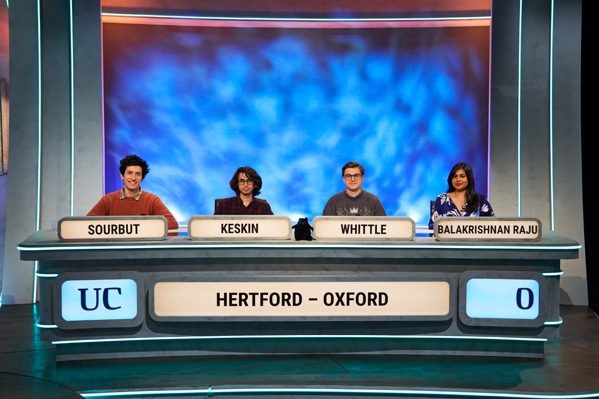 Sourbut, Keskin, Whittle, and Balakrishnan Raju sat at the Hertford Oxford desk at the University Challenge set