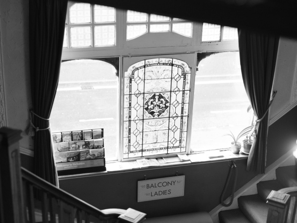 Looking down onto the stained glass and stairs from the upper floor.