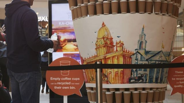 Photo of exhibition showing how many single use coffee cups we use in Leeds