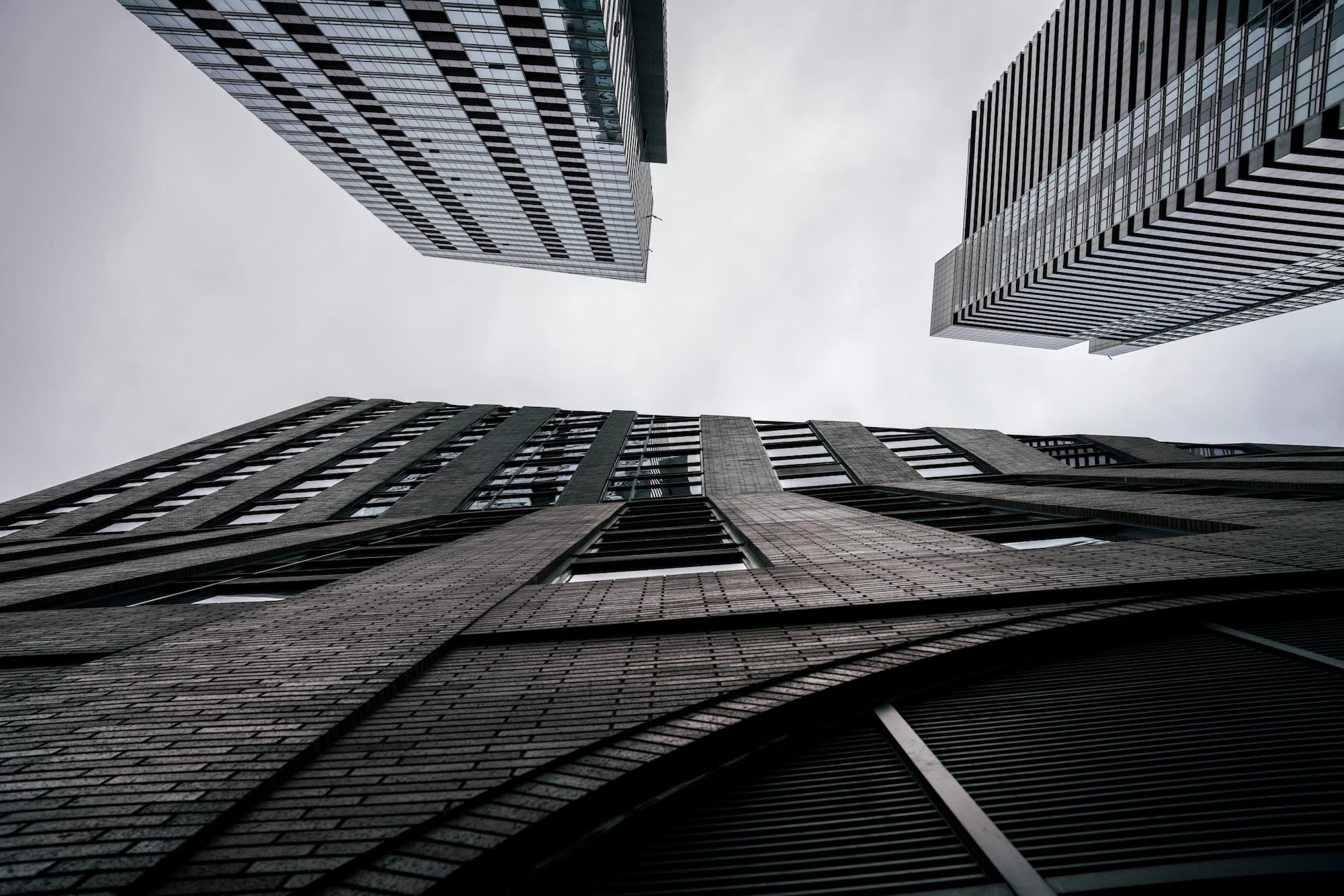 Display of tall buildings representing a formal corporate setting, indicative of the company's financial reports and professional status.