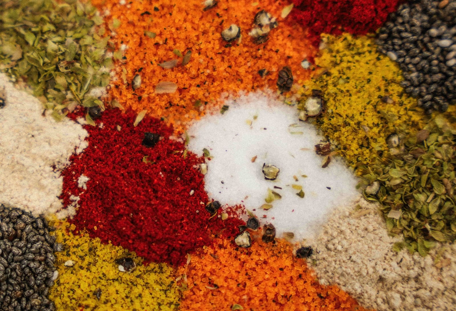 Multiple spices spread across a table.