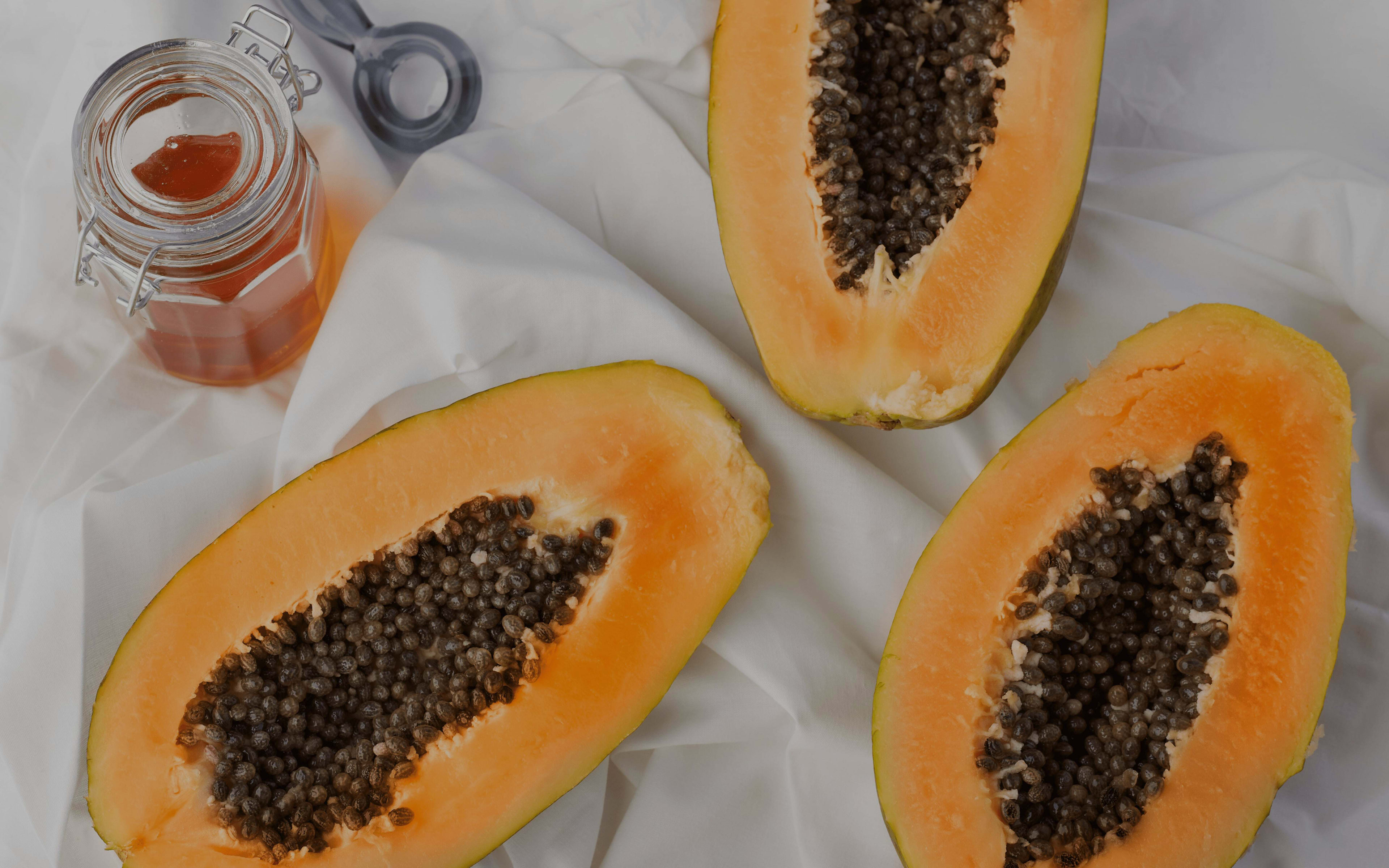 Papaya programme cover photo showing papayas laid out on a cloth