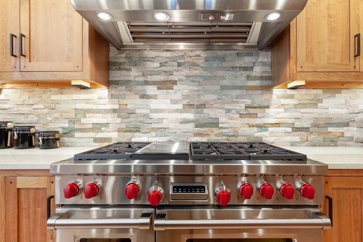 Installing stainless steel kitchen backsplash!