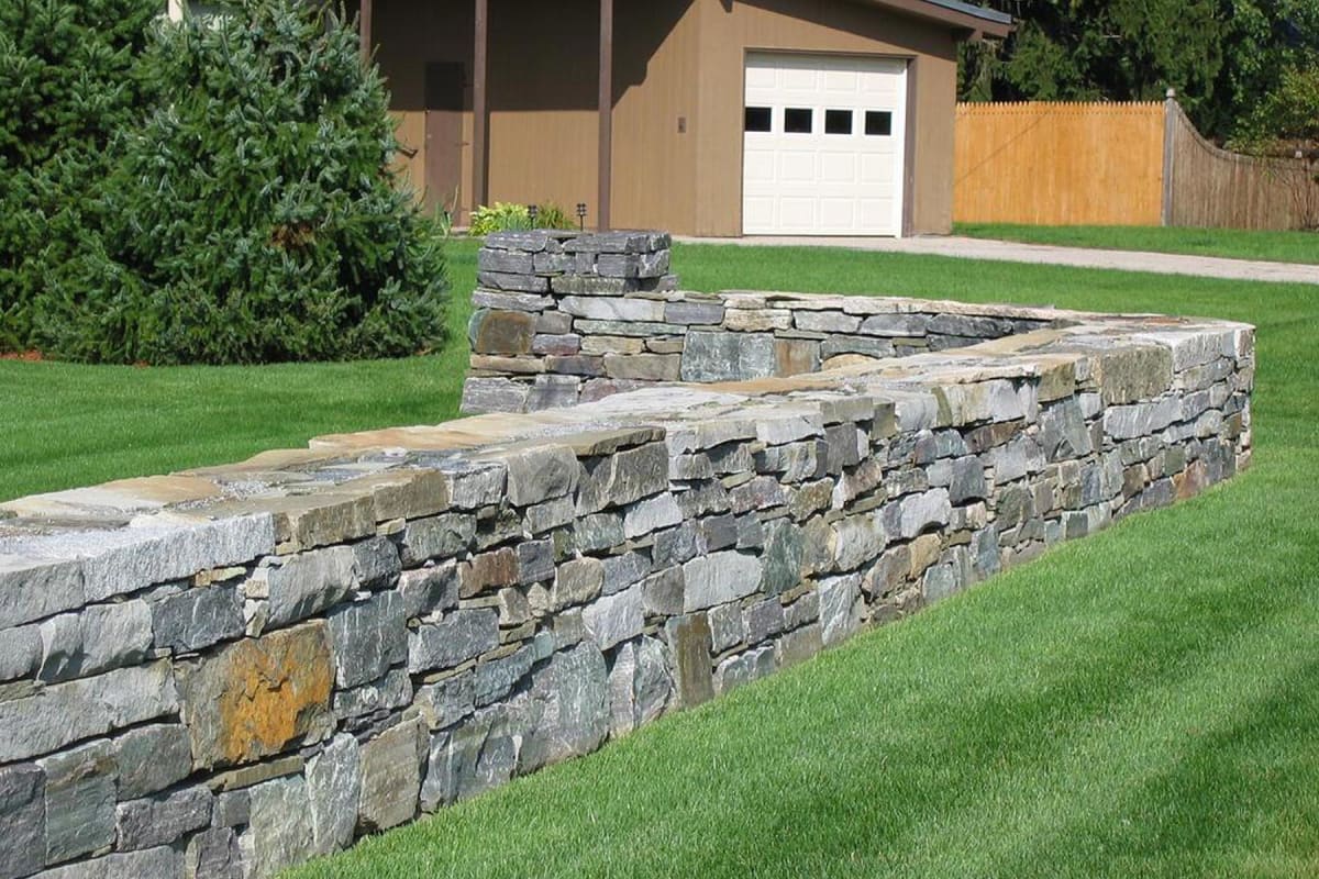 How Much Does A Brick Or Stone Wall Cost 2023   Homeguide Natural Stone Rock Wall In Front Yard Llyhmq 