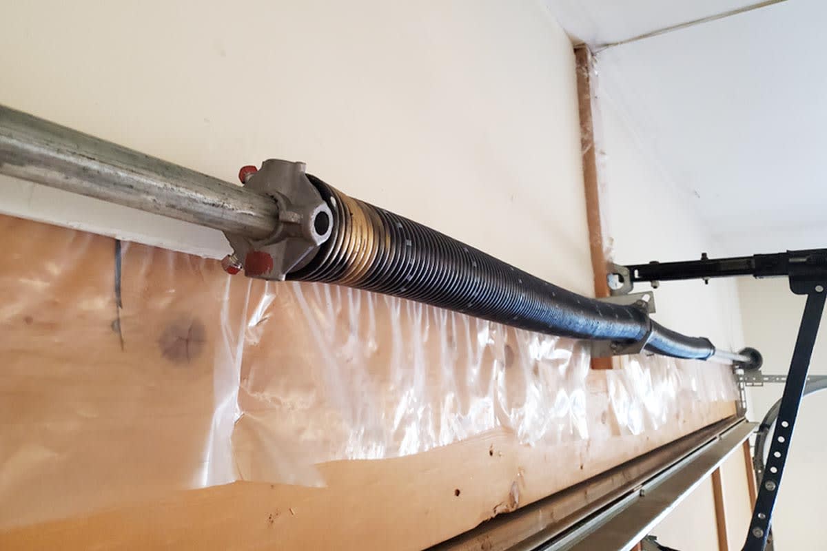 How much does it cost to repair or replace a garage door spring?