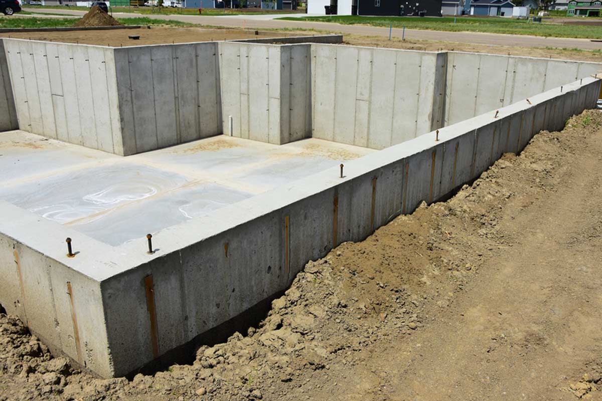 poured concrete walls vs block cost