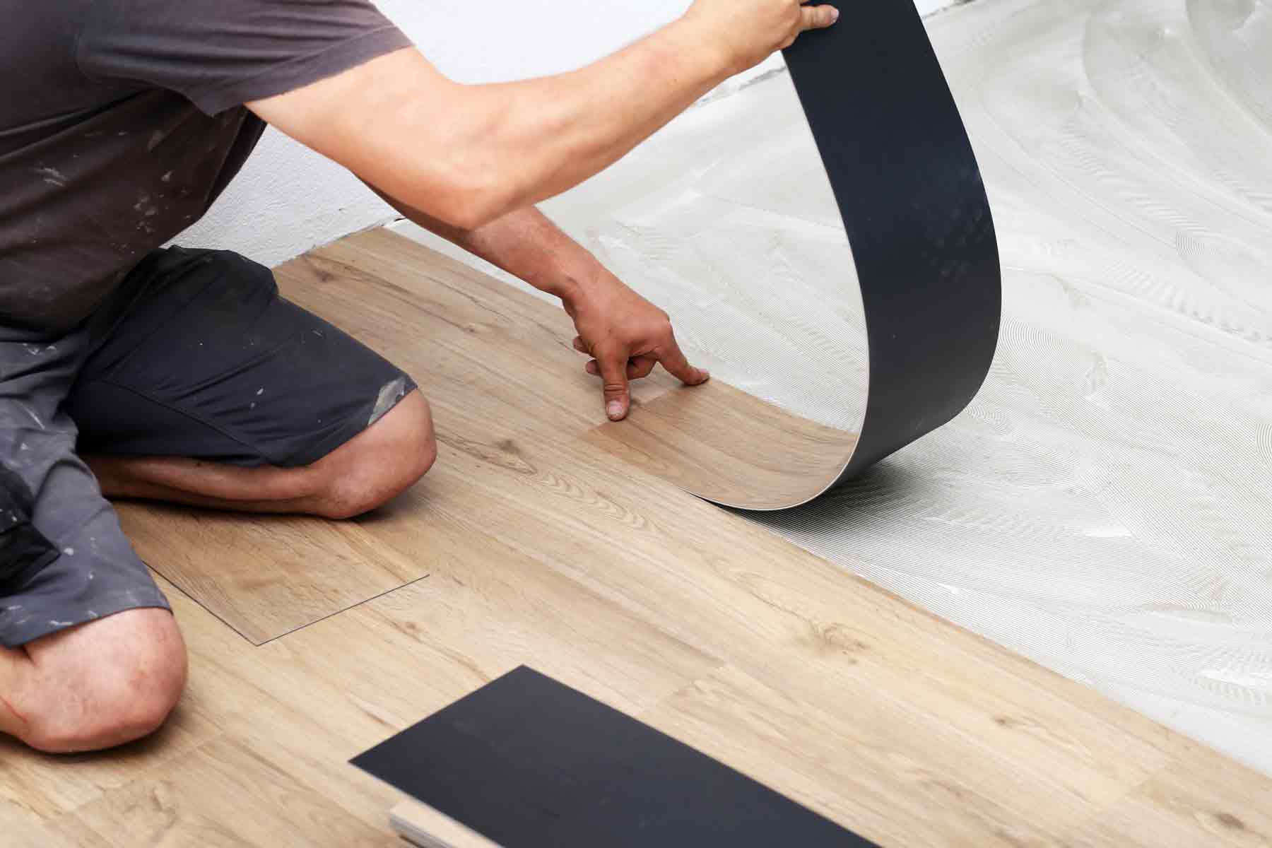 Homeguide Worker Laying Vinyl Flooring 