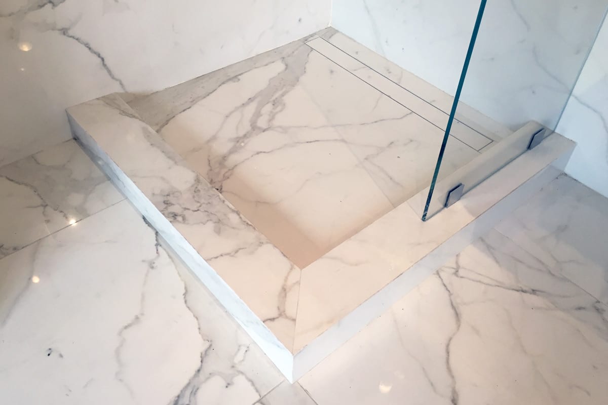 How much does it cost to install or replace a shower pan?