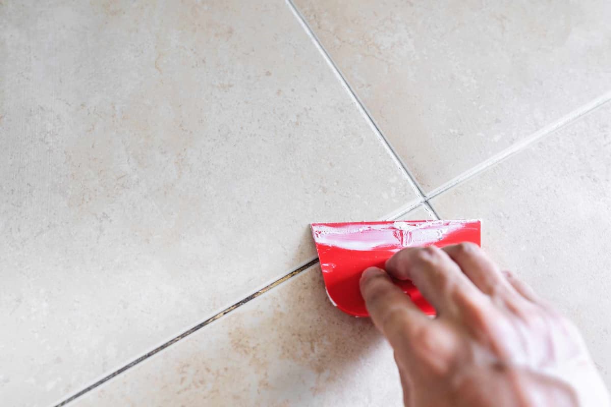How much does it cost to regrout tile?