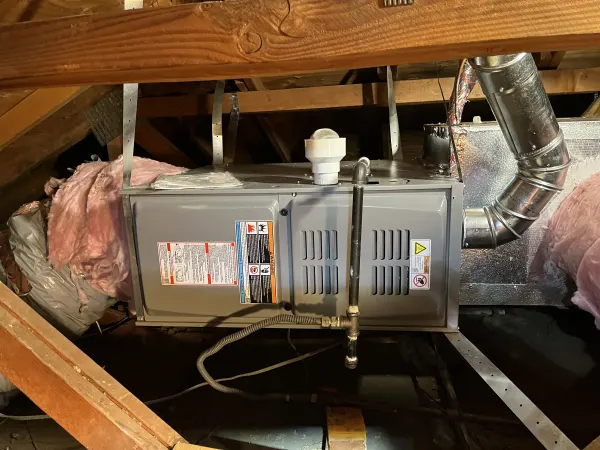 Expert furnace installation in tight attic spaces. Ensuring your home stays warm and energy-efficient