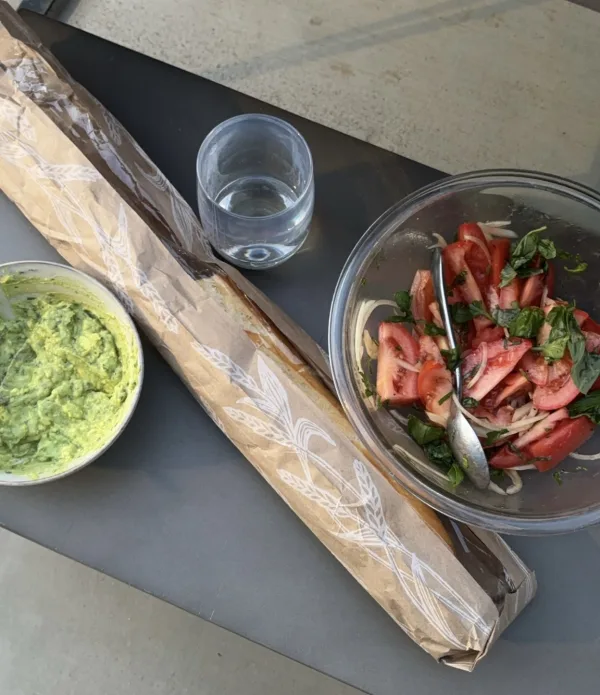 simple tomato summer salad with fresh baguette and a cilantro avocado mash.